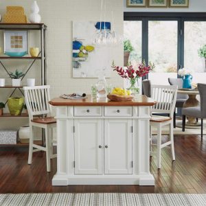 Homestyles Americana Distressed Off-White Oak Kitchen Island Set with Two Counter Stools  |  Kitchen Carts Kitchen Carts Kitchen Carts